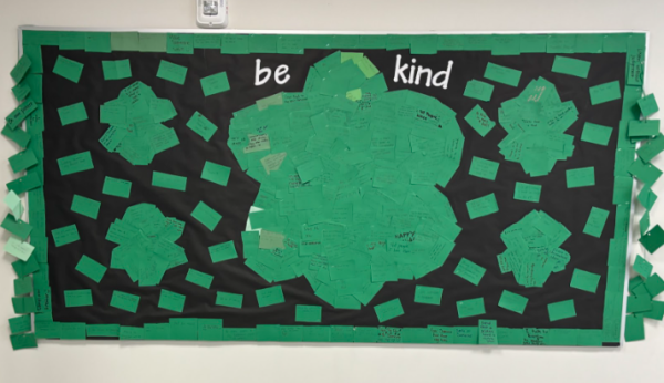 The “Be Kind” bulletin board outside the Nonnewaug library shows the acts of kindness that students have committed to doing, part of the commemoration of those who died at Sandy Hook Elementary School in 2012.