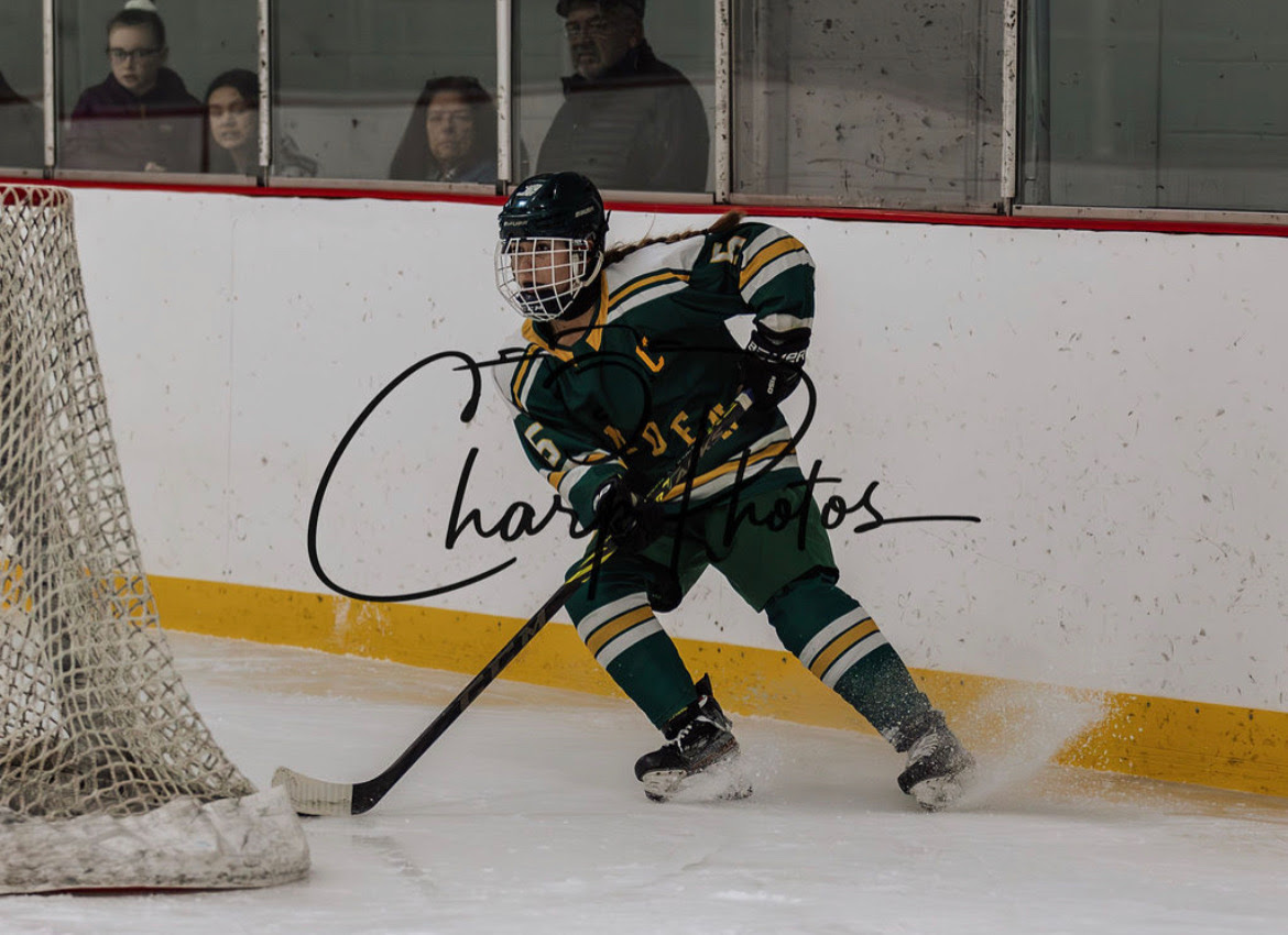 Sara+Norton+takes+possession+of+the+puck+during+a+recent+hockey+game+with+Hamden.+%28contributed%29