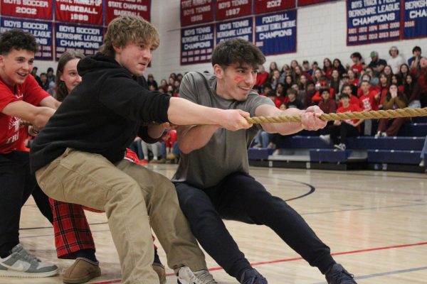 Nonnewaugs junior class, led by Jeff Bernardi, right, competes in the tug of war the red-out pep rally Feb. 2.