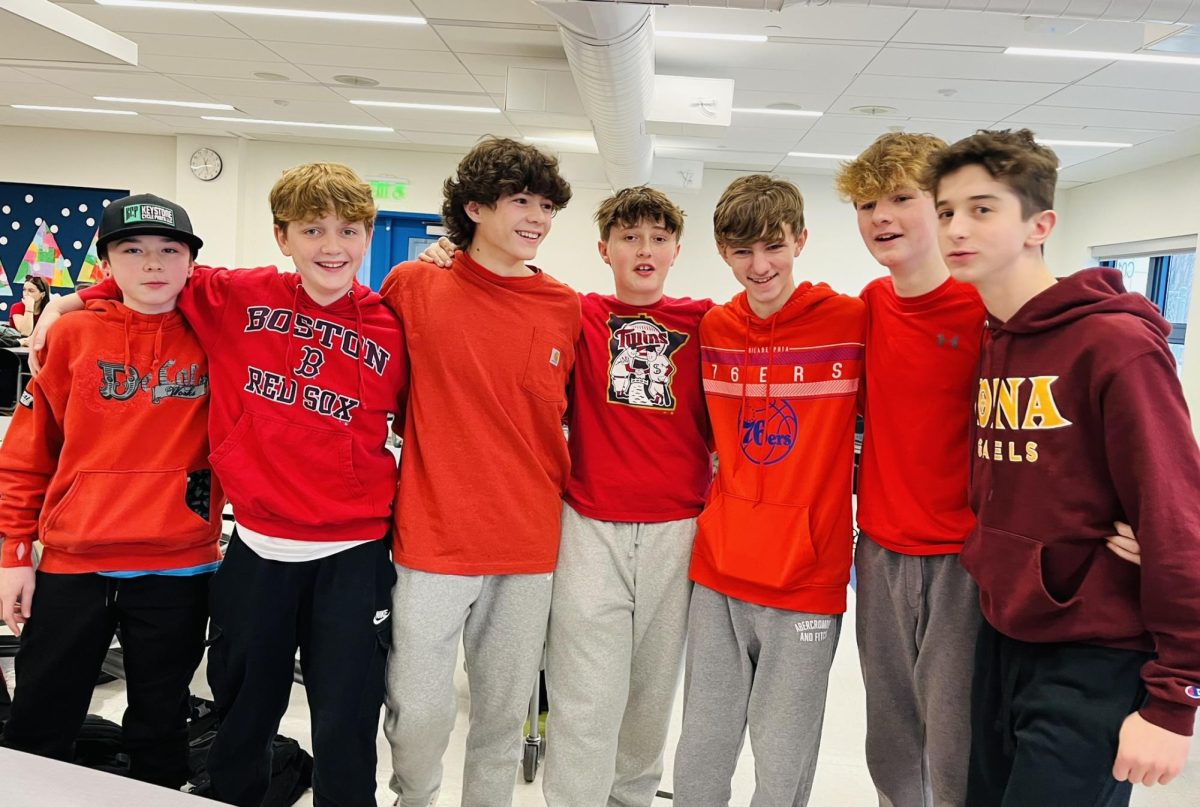 Nonnewaug freshmen, from left, Deegan Vroom, Ethan Butkus, Henry Strzelecki, Max Sorcher, Mason Ryan, Cameron Packett, and Maxton Nichols take a picture during lunch in the red-out Feb. 2.