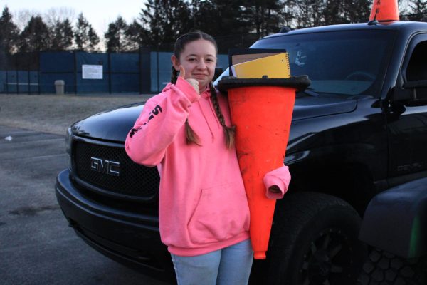 Brooke Akerman shows off her traffic cone on Anything But a Backpack Day.