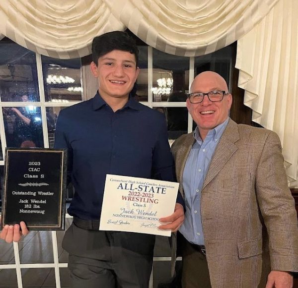 Former Nonnewaug wrestler Jack Wendel, a 2023 graduate, poses with coach Dave Green at the All-State banquet after receiving the honor for wrestling. Although a great wrestler, Wendels name is not on the gym walls because he lost his sophomore season to the COVID-19 pandemic, causing him to finish shy of 100 career wins. (Courtesy of Jack Wendel)