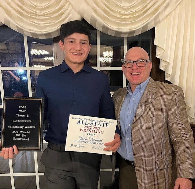 Former+Nonnewaug+wrestler+Jack+Wendel%2C+a+2023+graduate%2C+poses+with+coach+Dave+Green+at+the+All-State+banquet+after+receiving+the+honor+for+wrestling.+Although+a+great+wrestler%2C+Wendels+name+is+not+on+the+gym+walls+because+he+lost+his+sophomore+season+to+the+COVID-19+pandemic%2C+causing+him+to+finish+shy+of+100+career+wins.+%28Courtesy+of+Jack+Wendel%29