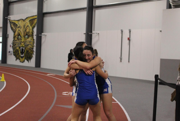 Members of Nonnewaugs 4x400-meter relay team embrace after a race earlier in the season. The group finished eighth at the State Open.