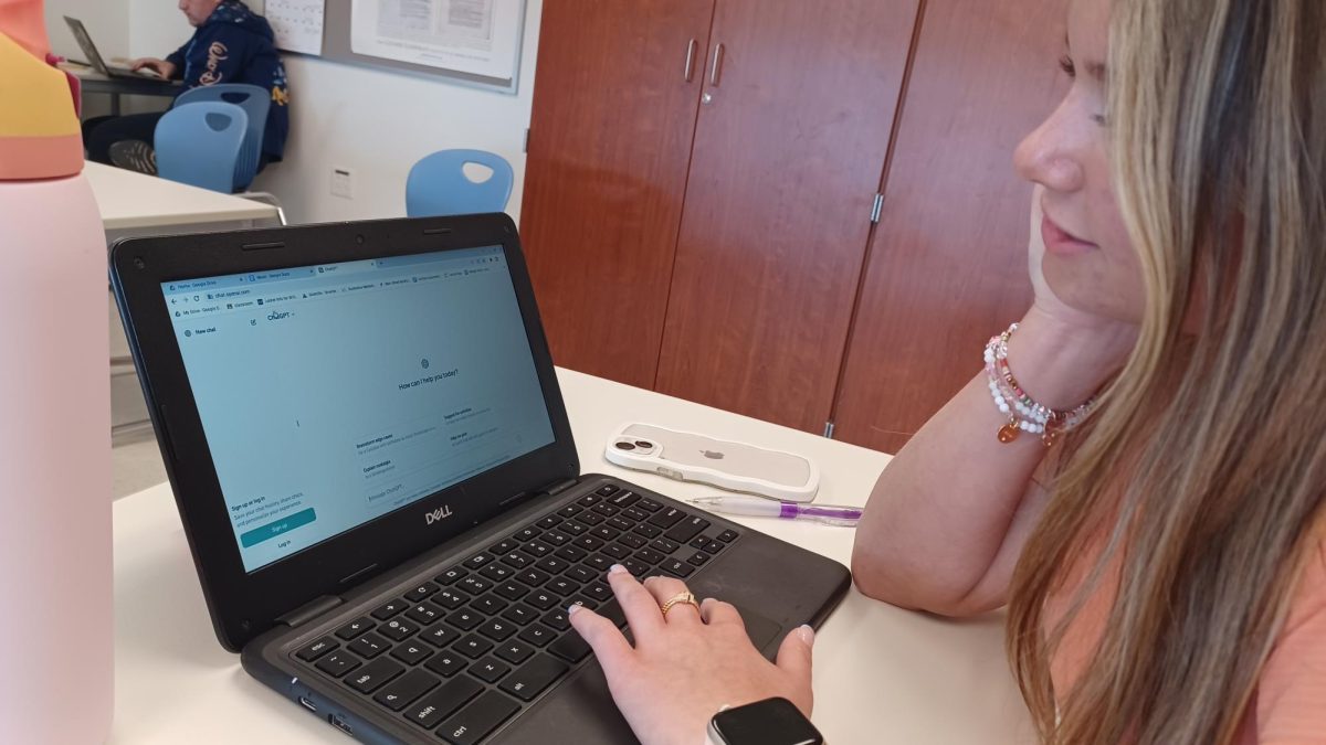 Nonnewaug freshman Morgan Willis opens ChatGPT on her Chromebook.