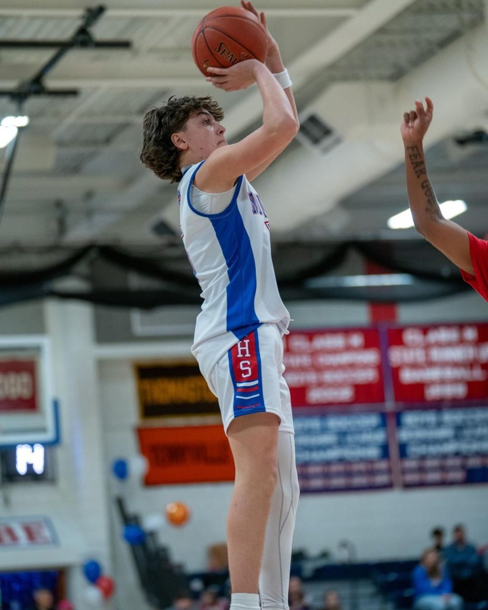 Nonnewaug sophomore Brady Herman shoots a jumper during a basketball game this winter. Herman, a three-sport athlete, isnt thrilled about the prospect of having practice for all three of his teams throughout the summer.