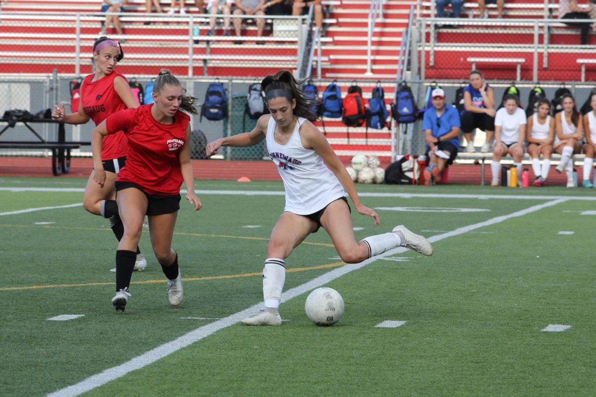 Nonnewaugs+Layla+Coppola+kicks+the+ball+up+field+during+a+scrimmage+against+Pomperaug.+The+soccer+teams+only+experience+with+nonconference+opponents+prior+to+the+state+tournament+has+been+the+scrimmages%2C+but+in+2024%2C+theyll+add+two+nonleague+opponents+to+the+regular-season+schedule.+%28Courtesy+of+Noreen+Chung%29