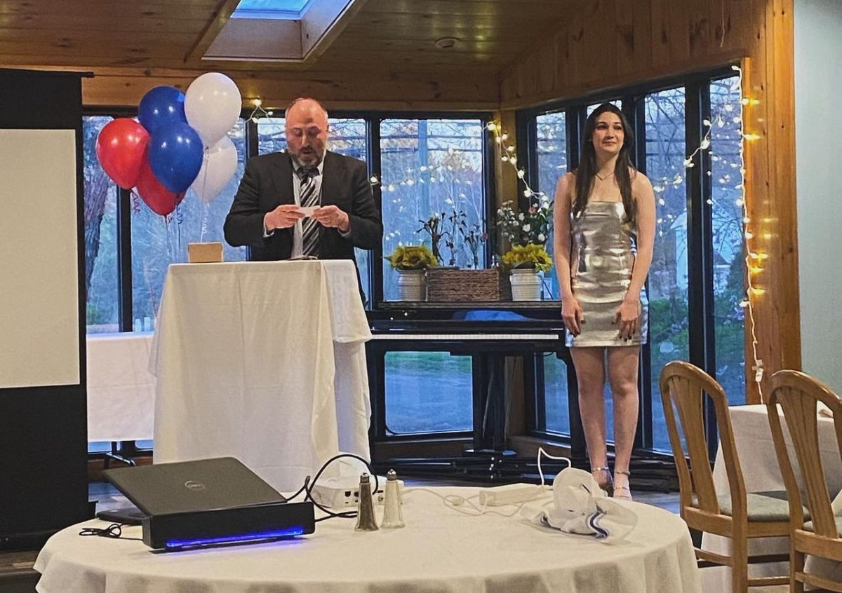 Ray Robillard gives his speech for valedictorian Anna Galvani at the academic banquet April 25 at the Painted Pony in Bethlehem. The speeches for the top 10% varied from satirical to heartfelt, but they all demonstrated public speaking being enjoyed by others, not being a cause of anxiety. (Courtesy of Nonnewaug High School/Instagram)