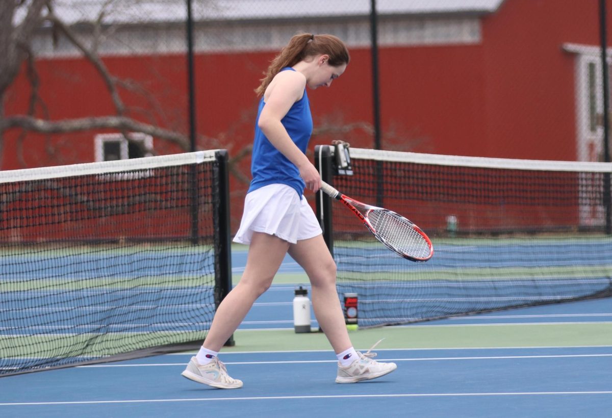 Kelly Farrell, a junior tennis player at Nonnewaug, prepares before a match against Wamogo on April 1. (Courtesy of Noreen Chung)