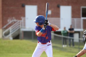 Nonnewaug freshman baseball player Ashton Elsemore bats during an April 8 game against Shepaug. Elsemore and most baseball players do not travel for spring break because the team has games and practices that week. (Courtesy of Noreen Chung)