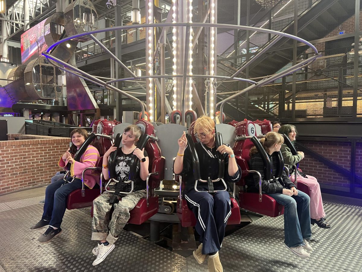 From left, Nonnewaug students Faith Lally, Lori Marquis, Dominik Udvardi, Eva Lavertue, and Ellie Mansfield wait to ride the drop tower located at Mega Parc, inside Galeries de la Capitale, a large and famous mall in Quebec.