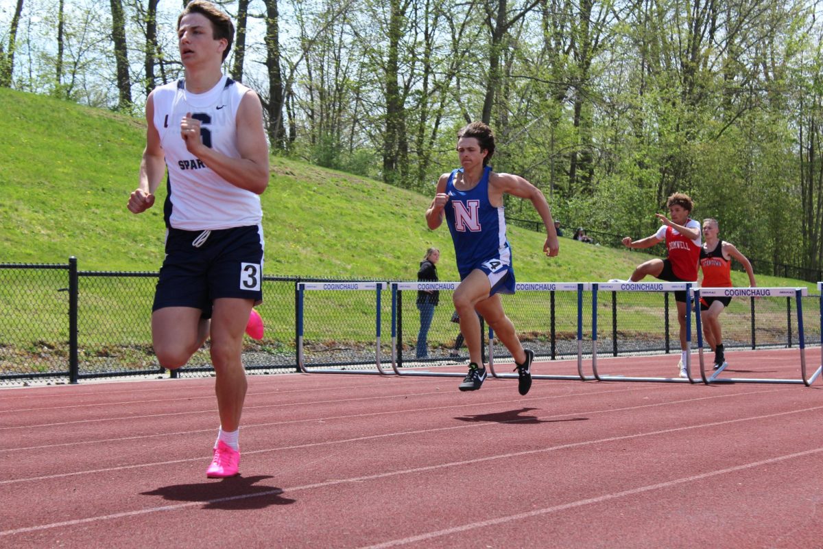 Nonnewaug’s Thomas Lengyel, completes the 6th hurdle of the 300m hurdle dash, he overall placed 6th.