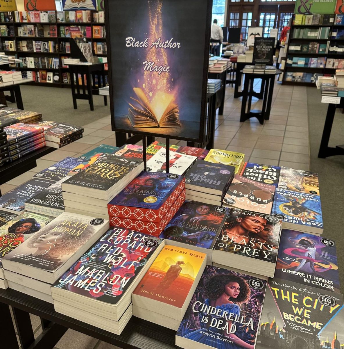 This table titled, “Black Author Magic,” features fantasy books written by Black authors, featuring Black characters. This table draws in readers with popular titles, like Legendborn by Tracy Deonn, and hopefully engages them to stay and browse the rest of the table. 