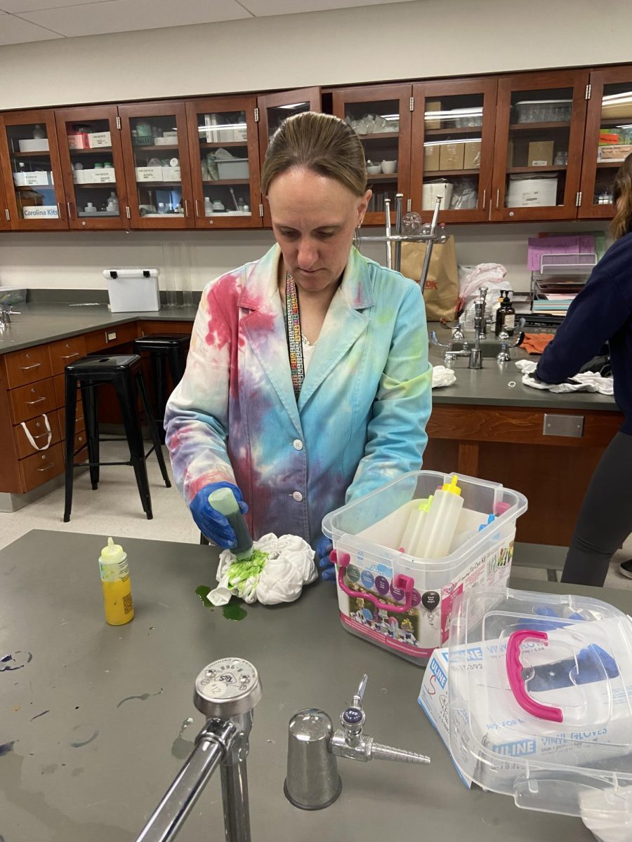 Melissa Hodges tie-dyes a t-shirt on May 3  in advance for her students AP Chemistry exam. 