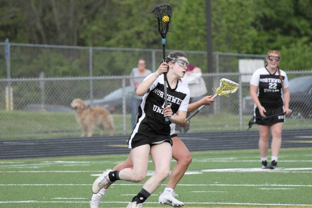 Gabby Guerra runs down the field with the ball during the Northwest United lacrosse game against Watertown on May 6 at Watertown.  