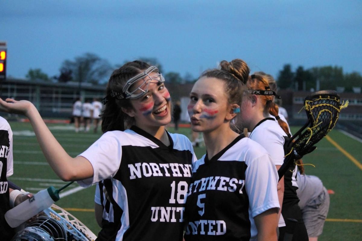 Caroline Donelly (18) and Sara Norton (5) pose together during the Northwest United lacrosse game against Watertown on May 6 at Watertown.   