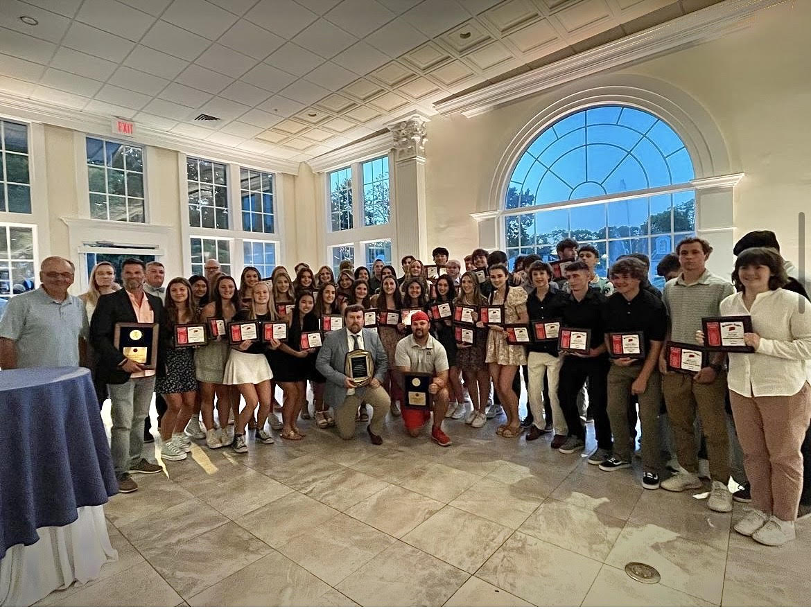 The Nonnewaug 2022-23 Berkshire League All-Stars stand with their award plaques, displaying their accomplishments throughout each respective sport season. (Courtesy of Nonnewaug athletics)