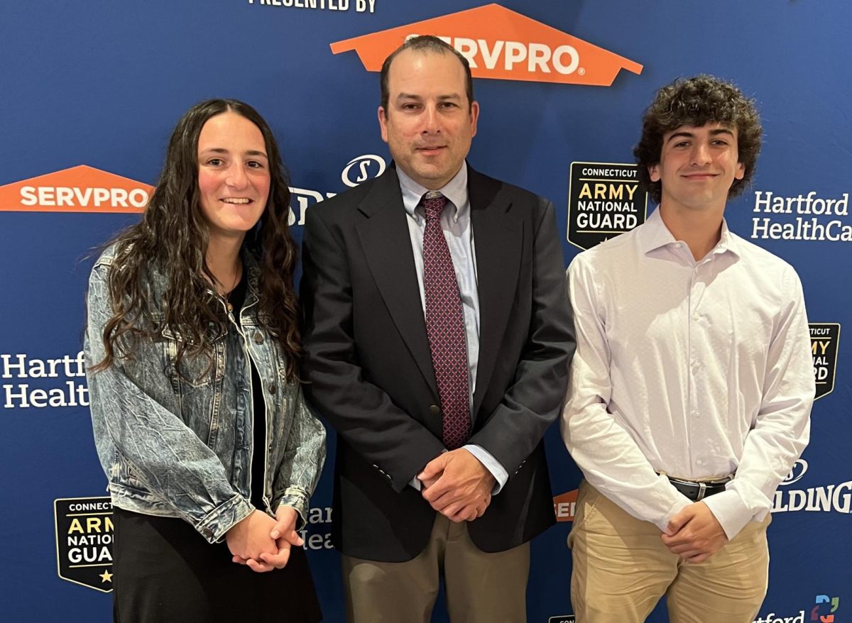 Nonnewaugs 2024 CIAC scholar-athletes, Gianna Lodice and Kyle Viveros, pose with girls soccer and boys tennis head coach Nick Sheikh at the CIAC Scholar-Athlete Awards Banquet, held on May 5 at the Aqua Turf Club in Southington. (Courtesy of Dana Lodice)