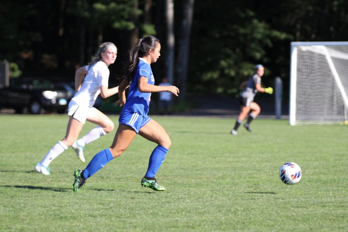 Nonnewaugs Ellie McDonald dribbles the ball during a game last season. McDonalds nickname is Smellie -- one of many Chief names that exist on the girls soccer team. (Courtesy of Noreen Chung)