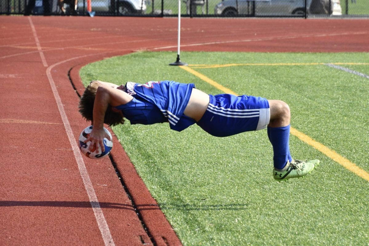 Nonnewaug's Durkin Stankevich completes a flip throw-in during the boys soccer game against Northwestern on Sept. 13 at the NHS turf field. 