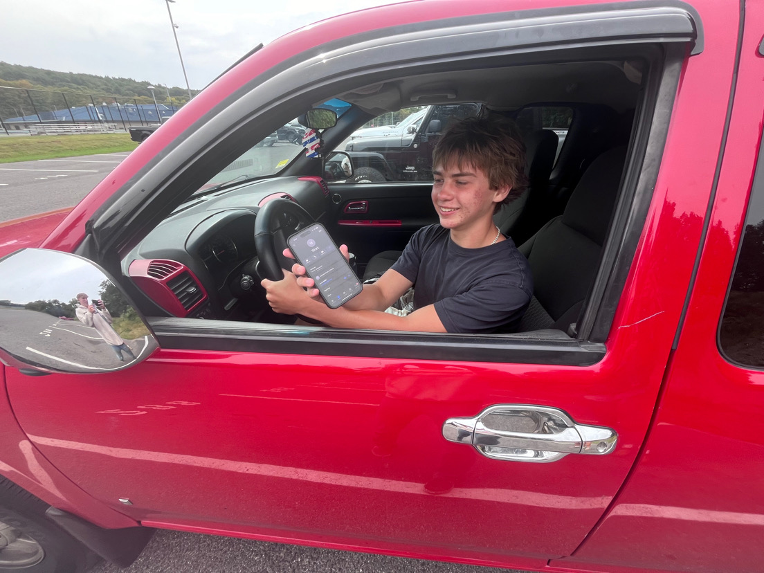 Jr. Bryson Gagne is driving to work during 7th period study hall. He is calling his boss to let him know he is coming. He has the work study paper so he can leave during study hall. 

