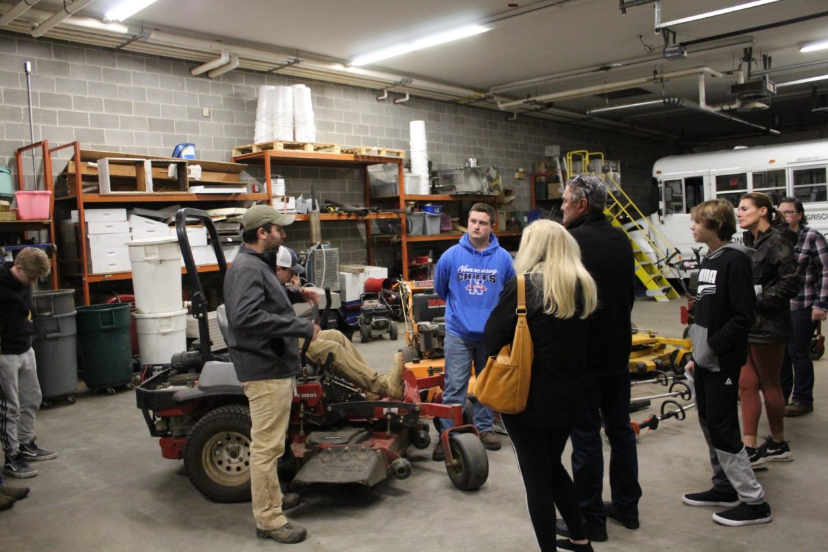 Former Nonnewaug landscaping instructor Tom DiMarco, left, talks to freshman parents and students about students options at the Ellis Clark Regional Agriscience Program during eighth-grade open house last year. (Chief Advocate archives)