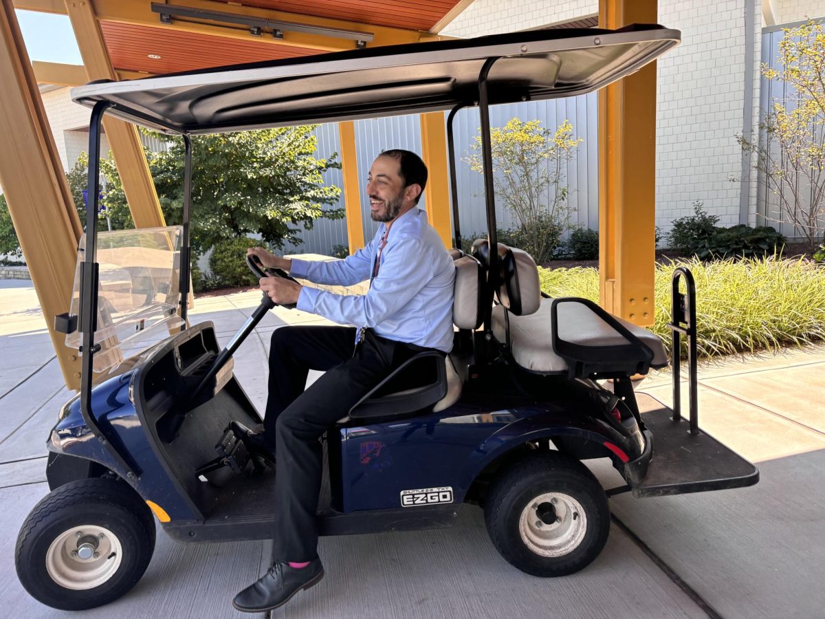 New Nonnewaug Athletic Director Andrew Tammero drives the athletics golf cart, previously belonging to now-assistant principal Declan Curtin, around the school. This new ownership signals the start of a year of changes as Tammero settles at Nonnewaug.