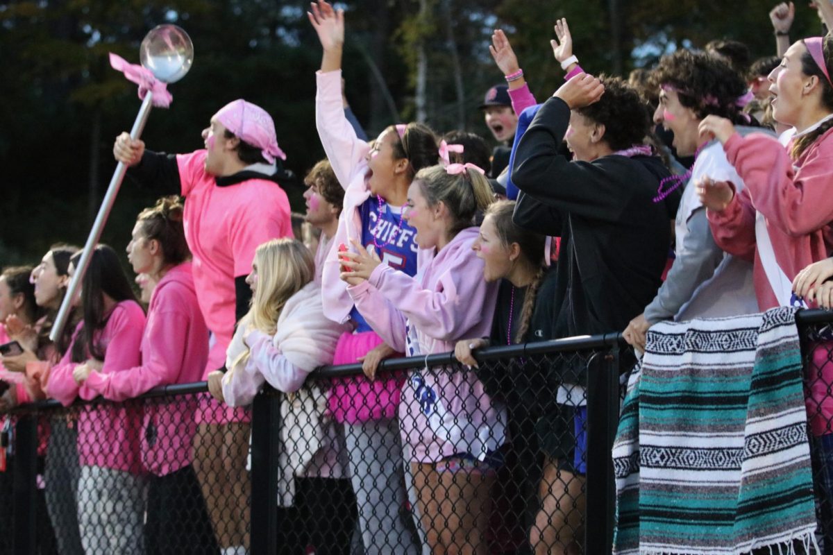 The Class of 2024 cheers at last year's homecoming football game, decked out in pink in support of Cancer Couch for Breast Cancer Awareness Month. The homecoming gameday this year is themed gold for the Tommy Fund for Childhood Cancer, and the stands are expected to be packed again. (Courtesy of Noreen Chung)