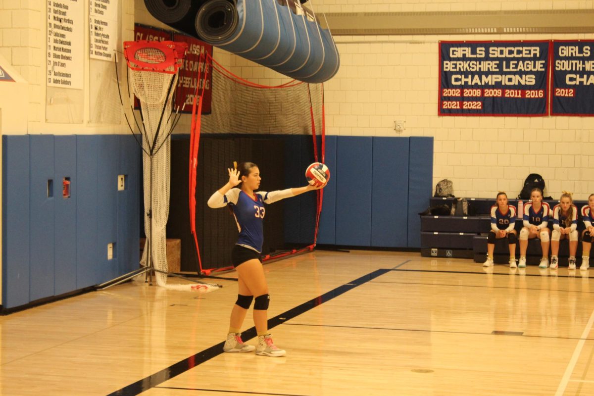 Lana Zupnick (33) prepares to serve during Nonnewaug's volleyball match against Gilbert on Sept. 19.