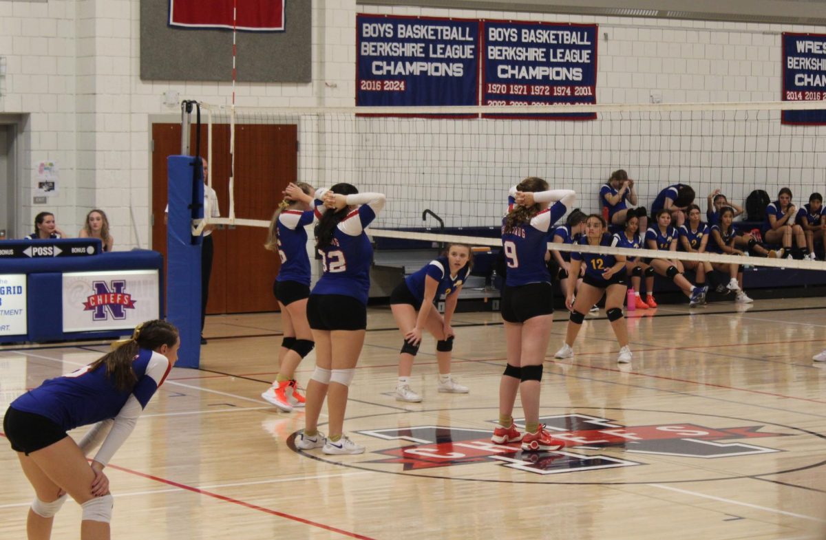 From left, Macey Chmiel, Emma Jackson, and Chloe Weaver wait for a serve during Nonnewaug's volleyball match against Gilbert on Sept. 19. 