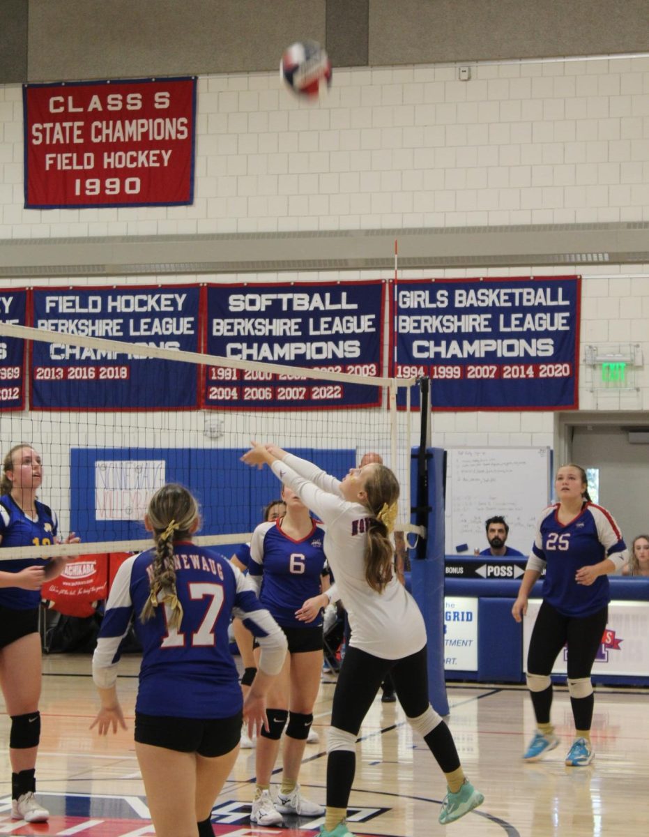 Jordan Kovach (0) sets the ball during Nonnewaug's volleyball match against Gilbert on Sept. 19.