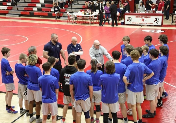 Dave Green delivers a speech to the Nonnewaug wrestling team before a match. Green has taught and coached at Nonnewaug for over 25 years. (Courtesy of Nonnewaug Wrestling/Instagram)