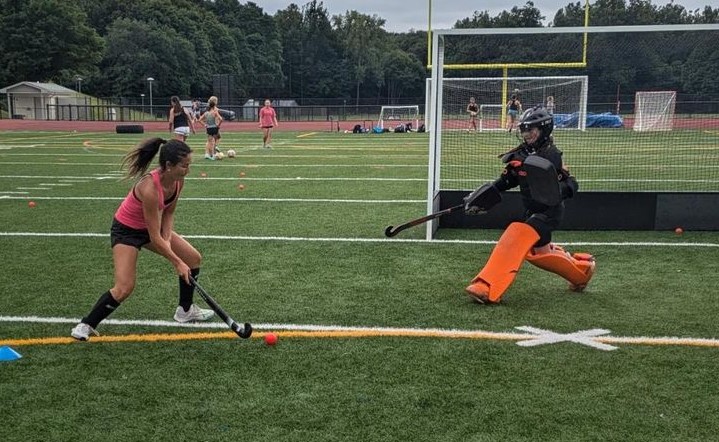 Junior Sophia Garguilo, left, practices over the summer during a camp for the Nonnewaug field hockey team. (Courtesy of Aim Athletes/Instagram)