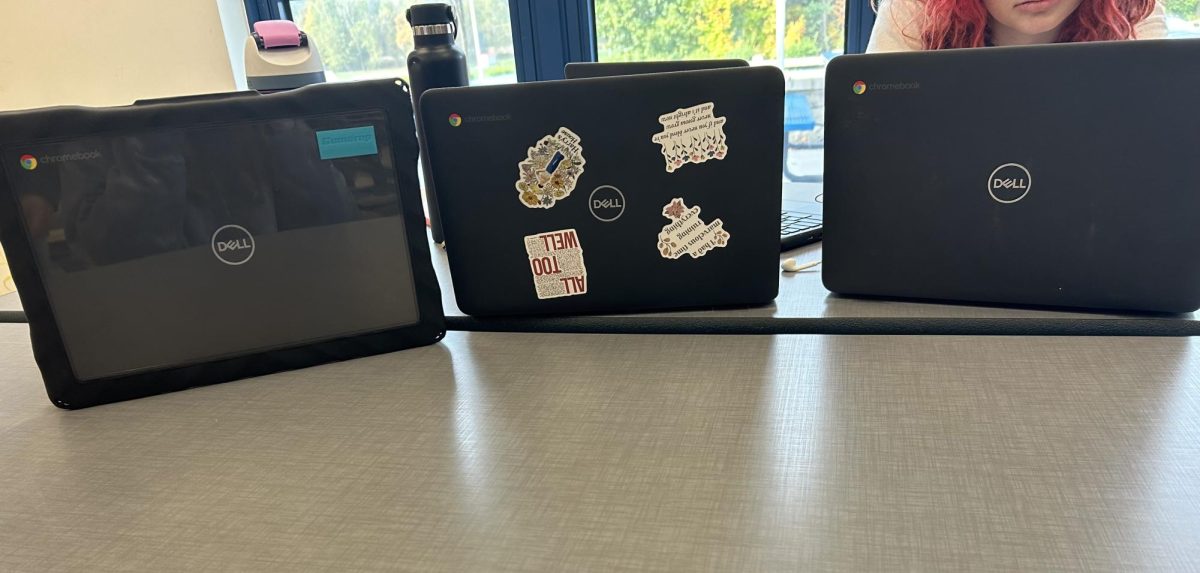 Students at Nonnewaug work during study hall. On the left, one student preferred to use the clear cases provided by the school, while the others opted for not using the case. 