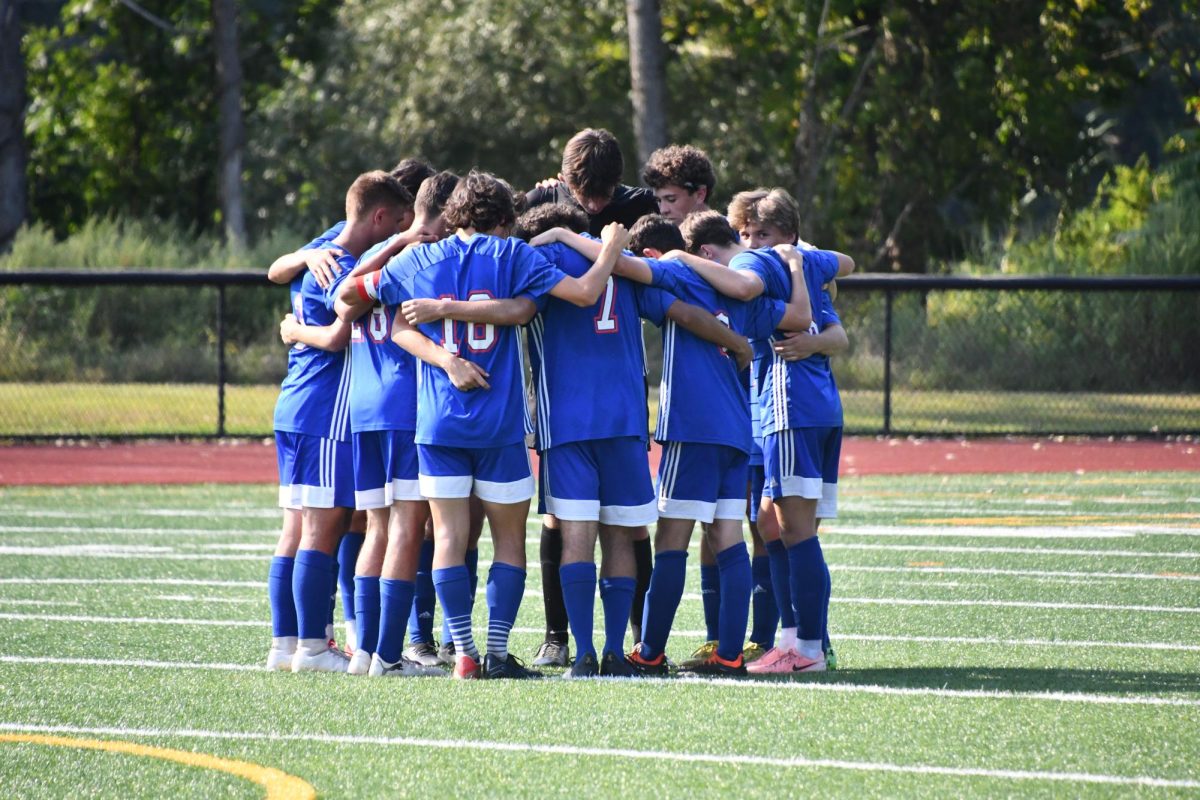 The boys varsity team huddles up before their game on Sept. 13 vs. Northwestern. The Chiefs will face Northwestern again in the Berkshire League semifinals.
