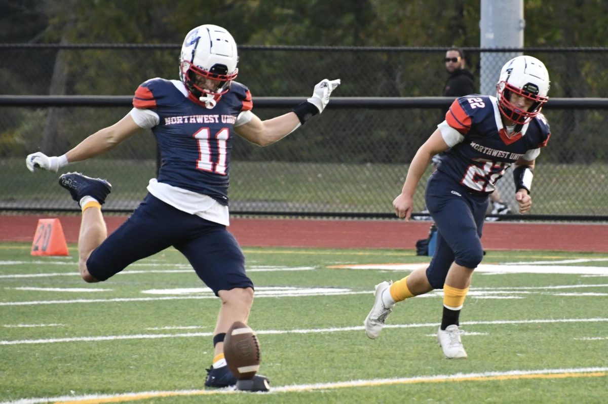 Northwest United's Reed Woerner (11) kicks off with James Shaughnessy (22) on coverage. Woerner attends Shepaug and Shaughnessy attends Lakeview, two of the four schools that comprise the co-op.