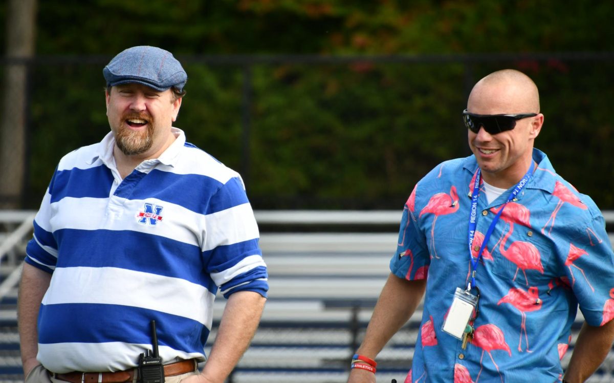 Nonnewaug assistant principal Declan Curtin, left, and principal Mykal Kuslis laugh together during the Class of 2025 Senior Field Day on Sept. 27. Curtin is in his first year as the assistant principal after six years as the athletic director and dean of students.