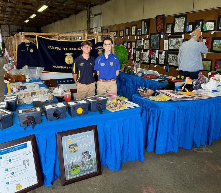 Woodbury FFA students (Connor Cabeleira and Garnet Mayfield) that volunteered at the local Bethlehem Fair on September 9, 10, 11 2024. Volunteer experiences like those students held at this fall's fairs helped to hone key skills FFA students need this semester. (Courtesy of the Woodbury FFA/ Instagram).