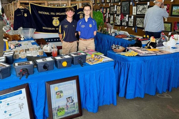 Woodbury FFA students (Connor Cabeleira and Garnet Mayfield) that volunteered at the local Bethlehem Fair on September 9, 10, 11 2024. Volunteer experiences like those students held at this fall's fairs helped to hone key skills FFA students need this semester. (Courtesy of the Woodbury FFA/ Instagram).