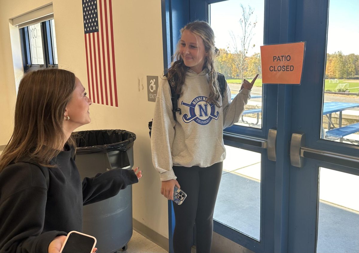 Ava Hirleman, left, and Jadyn Heron notice that the cafeteria patio is closed due to aggressive yellowjackets.