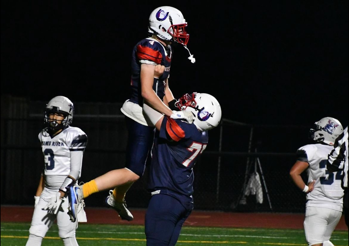 Senior Carson Shaughnessy celebrates captain Rj Barksdales second touchdown of the night. 
