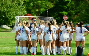 The Nonnewaug girls soccer huddles during halftime of a game against Thomaston. Conversations like this help build the camaraderie that's important in sports. (Courtesy of Jen Salisbury)