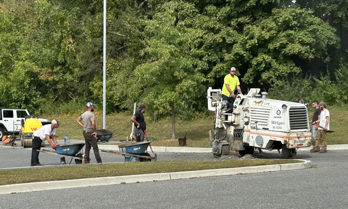 Construction workers tear up and replace an old speed bump in the front parking lot at Nonnewaug to be more accessible to students and the public. (Courtesy of Kyle Brennan)