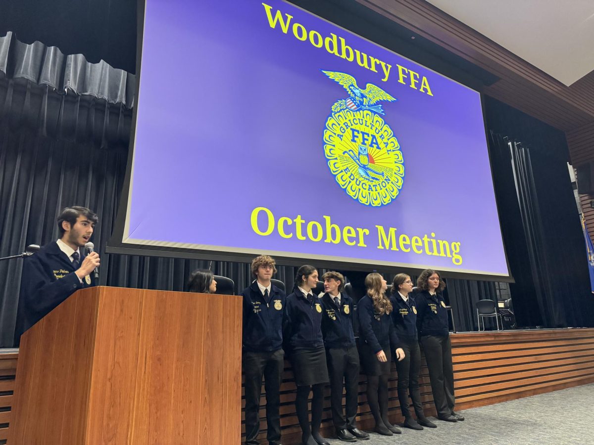 Woodbury FFA Luciano Pedros, left, gathers the FFA chapter's attention with his fellow officers by his side to start the second meeting of the month Oct. 18 during Focus.