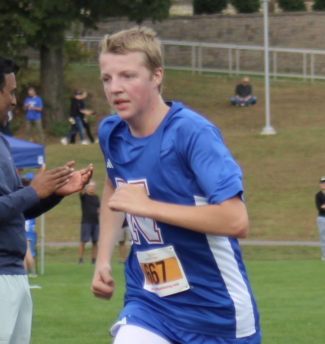 Junior Andrew Singletary runs during the Nonnewaug invitational on Oct. 4th 
