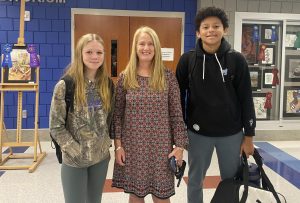 Nonnewaug interim assistant principal Suzi Greene, center, is able to reconnect with freshmen Maci Johnson, left, and Martin Razo. After being assistant principal at Woodbury Middle school for many years, no one expected Greene to be back at Nonnewaug in this interim role.