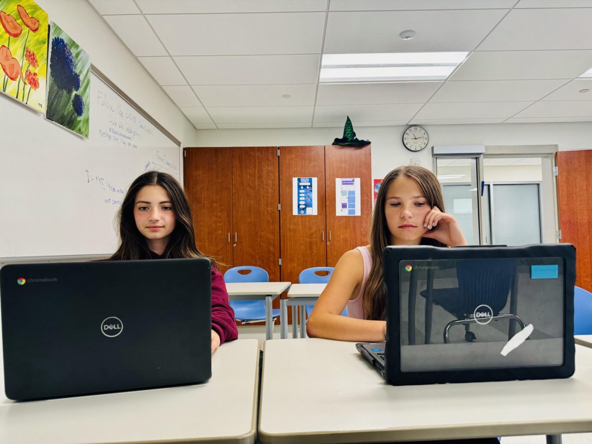 Fiona Scozzafava, left, and Thea Oleynikov work on assignments during Tribe. Being athletes, freshmen students like Scozzafava and Oleynikov have utilized this time to keep up with class assignments and meet with instructors while juggling fall sports. 