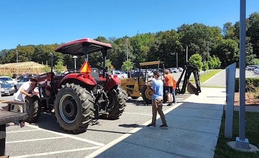 Students working with the school’s old Case and Ford tractors during freshman tractor driving class. (Courtesy of Woodbury FFA/Instagram)