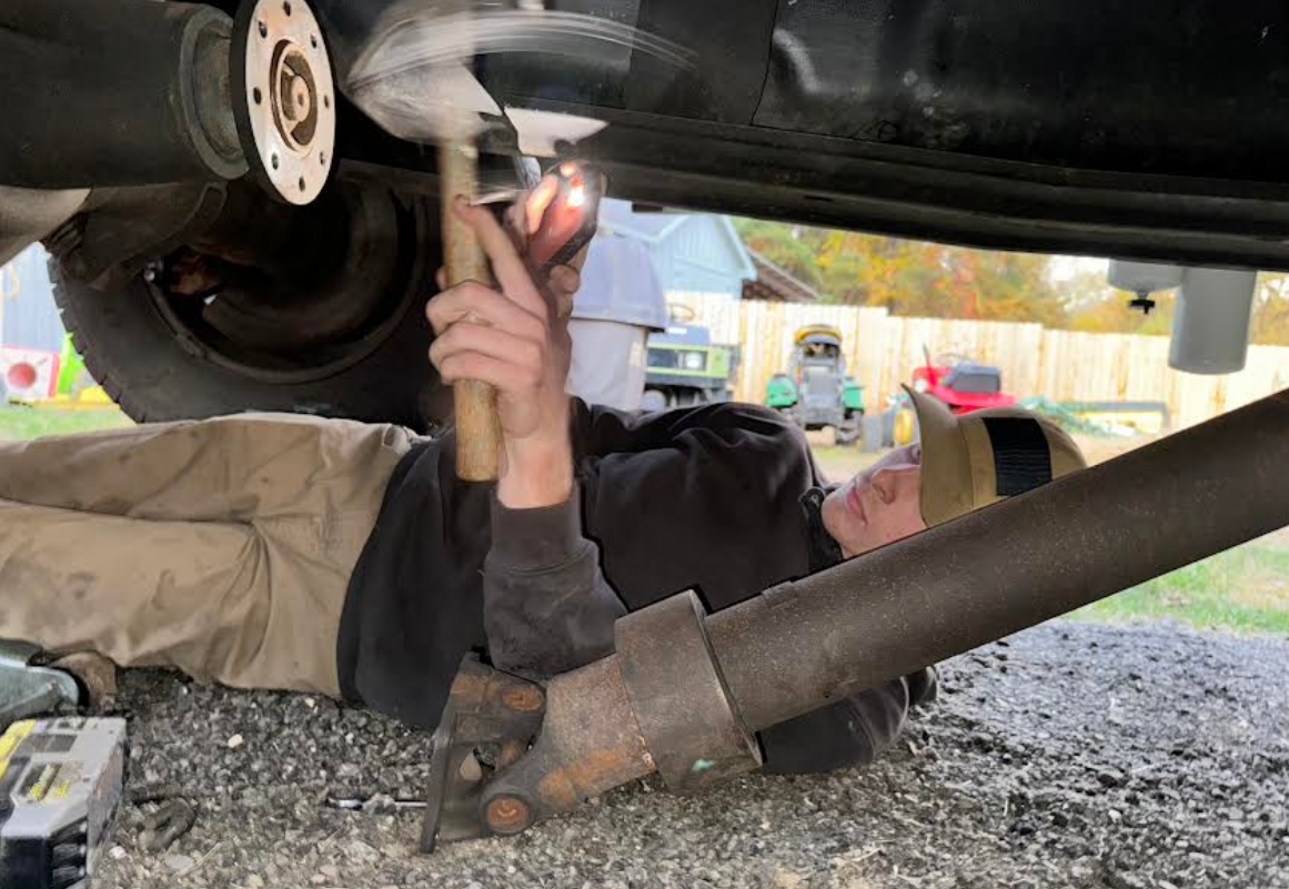 Noah Zupan works on a truck. He takes advantage of the work study program and leaves during study hall for his job. (Courtesy of Noah Zupan)