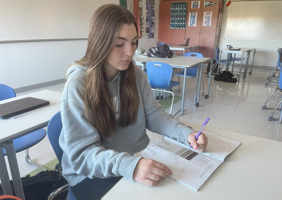 Kailey Meeker organizes her schedule using a planner.